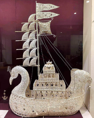 A sculpture of a ship
Description automatically generated