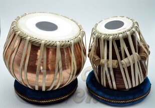 A pair of drums with white strings
Description automatically generated